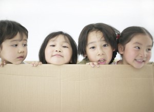 Four Children in Cardboard Box