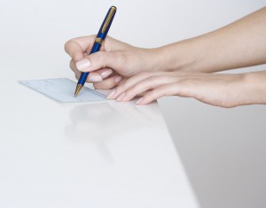 Woman Writing a Check