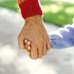 Adult and Daughter (9-10) Holding Hands
