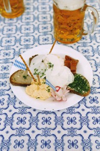 Plate with typical bavarian snacks and beer